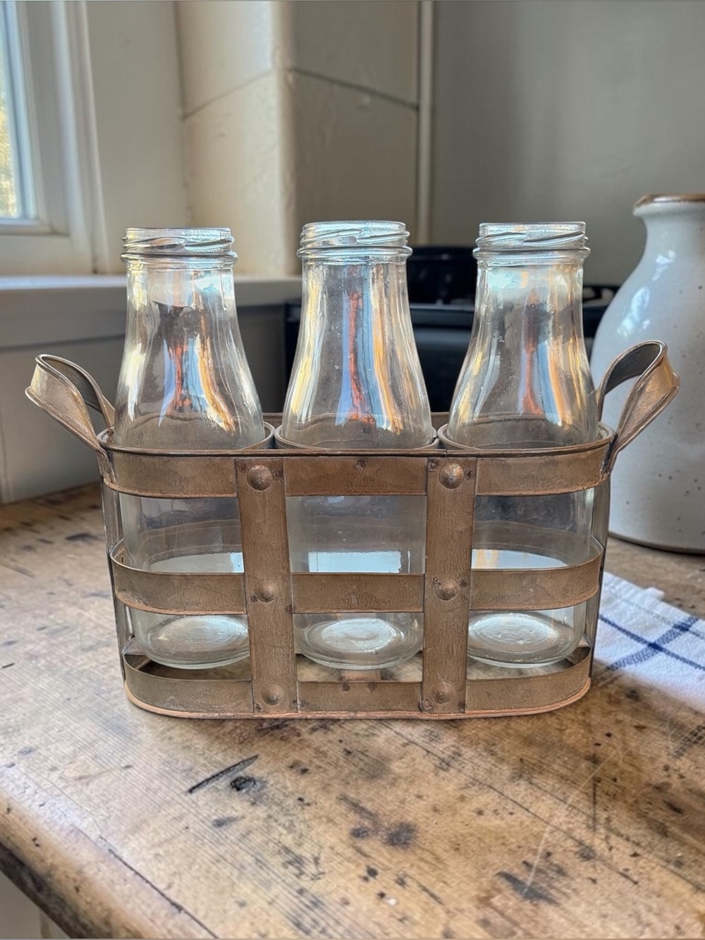 VINTAGE RUSTIC METAL CADDY WITH THREE GLASS MILK BOTTLES — FARMHOUSE DECOR SET